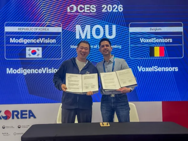 CEO Kim Dae-hee and VoxelSensors CPO Christian Mourad holding signed MoU documents in front of a CES 2026 backdrop